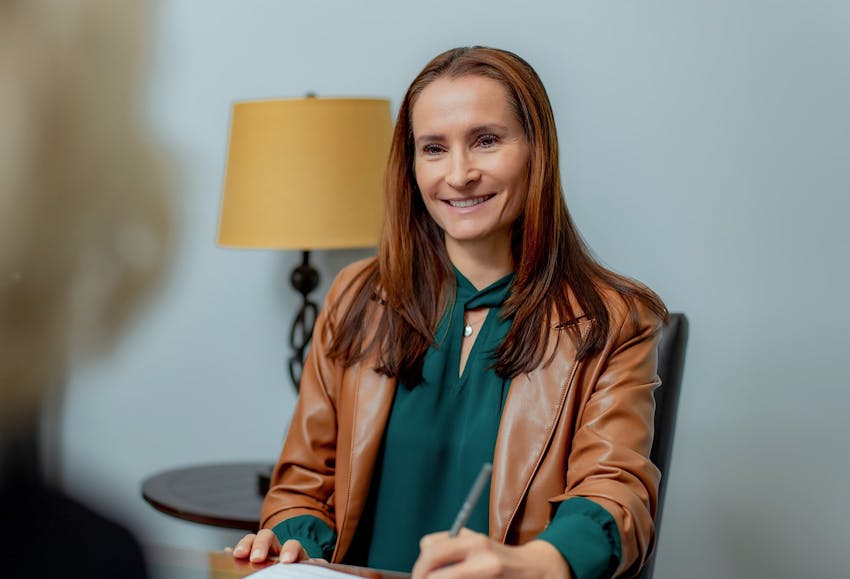 Woman signing documents