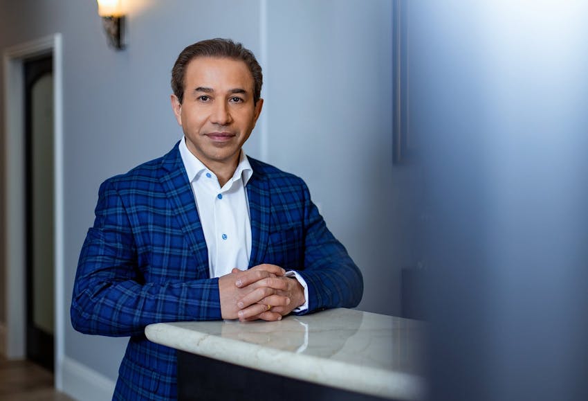 Doctor with hands on counter