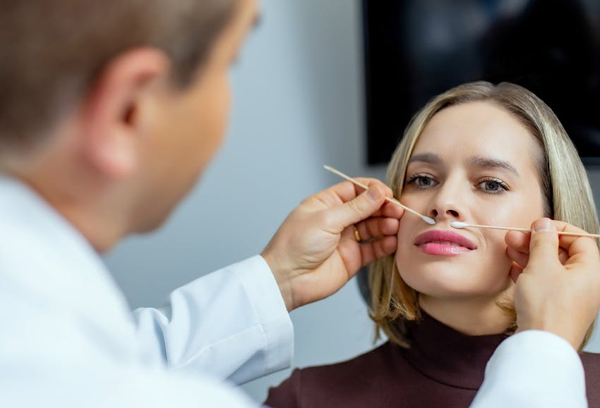 Doctor inspecting patient