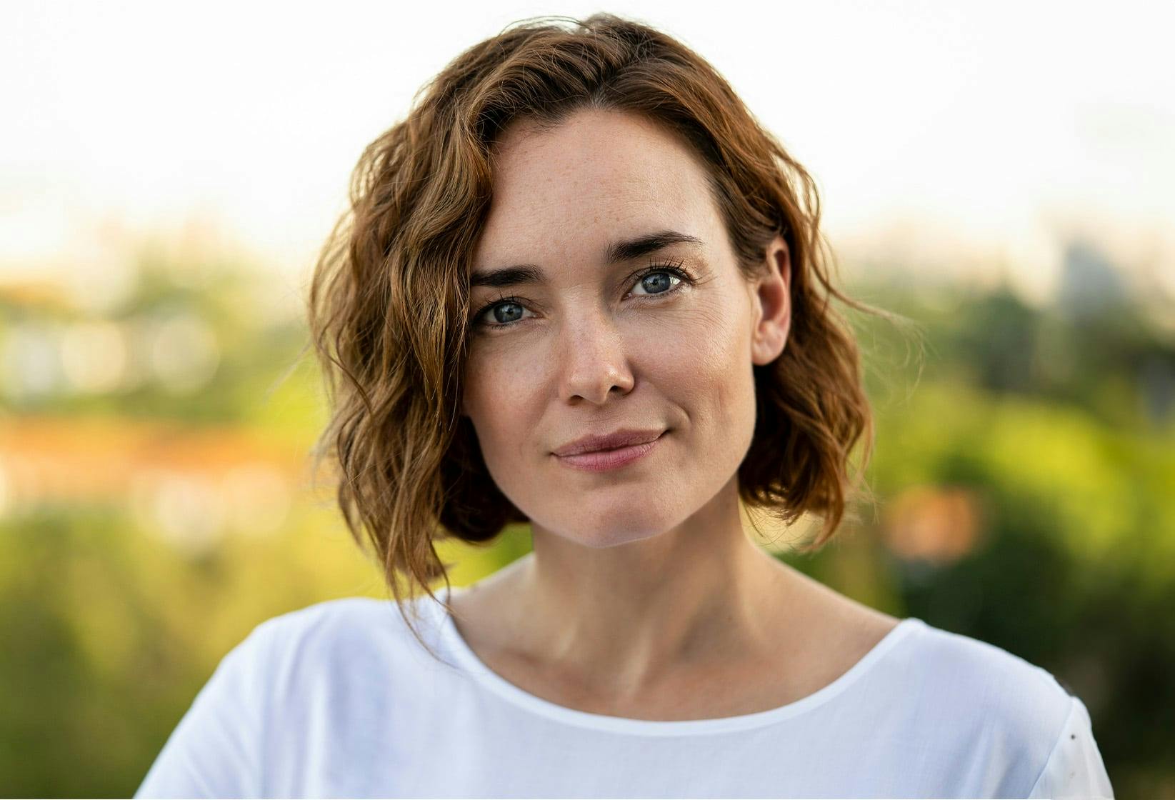 Woman outside smiling