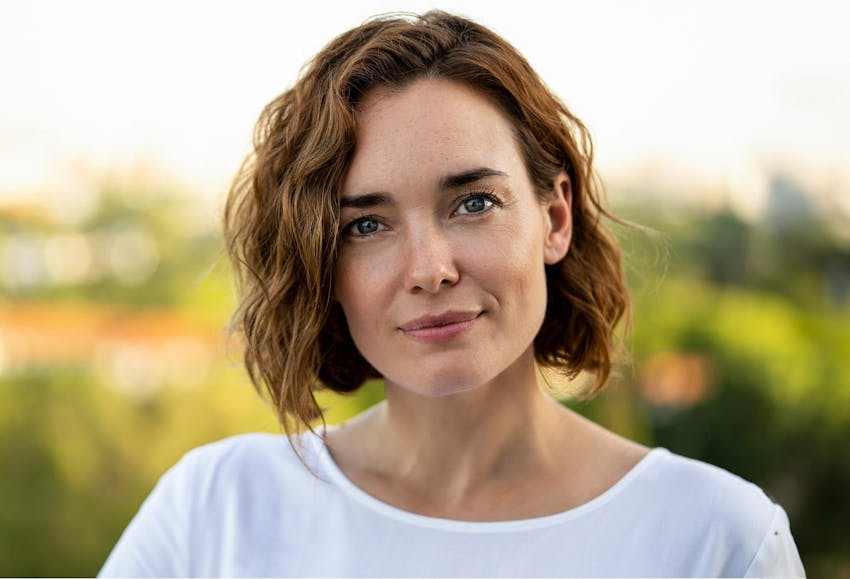 Woman outside smiling