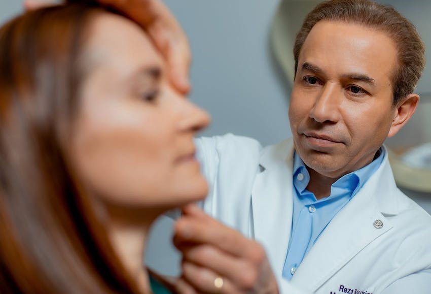 doctor inspecting patient