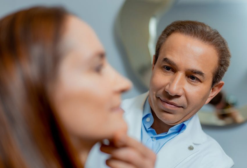 Doctor inspecting patient