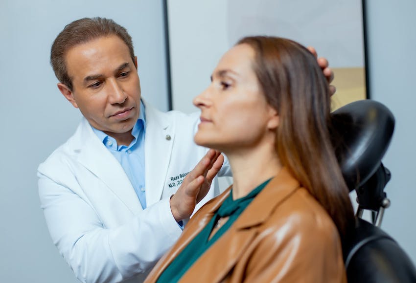 Doctor inspecting patient