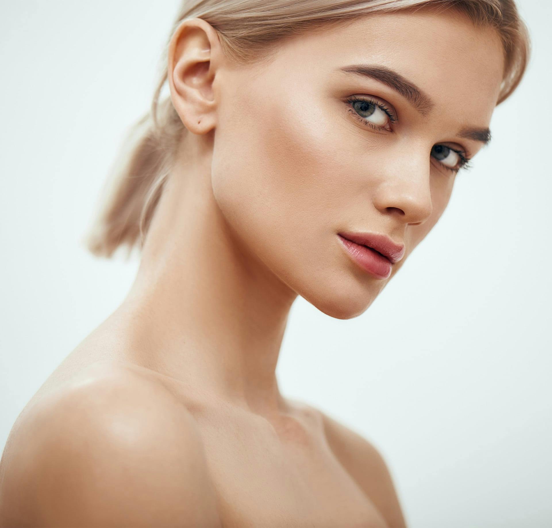 woman with blonde hair in a low ponytail