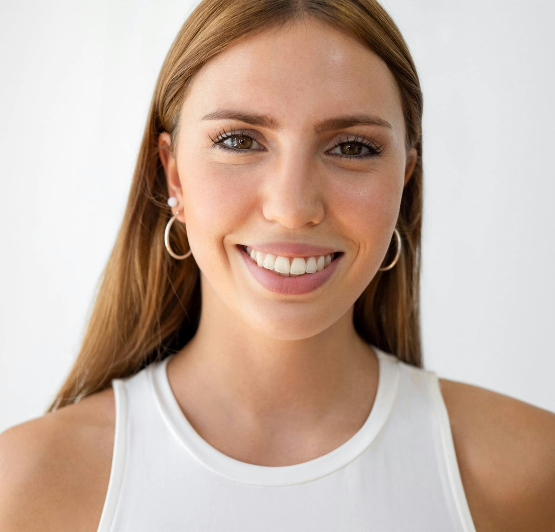 woman in a white tank top