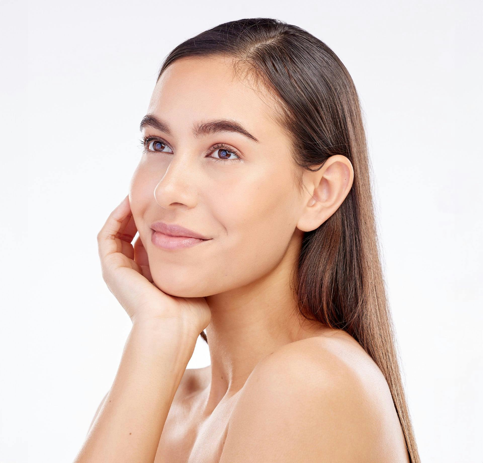 Woman smiling and resting chin on hand