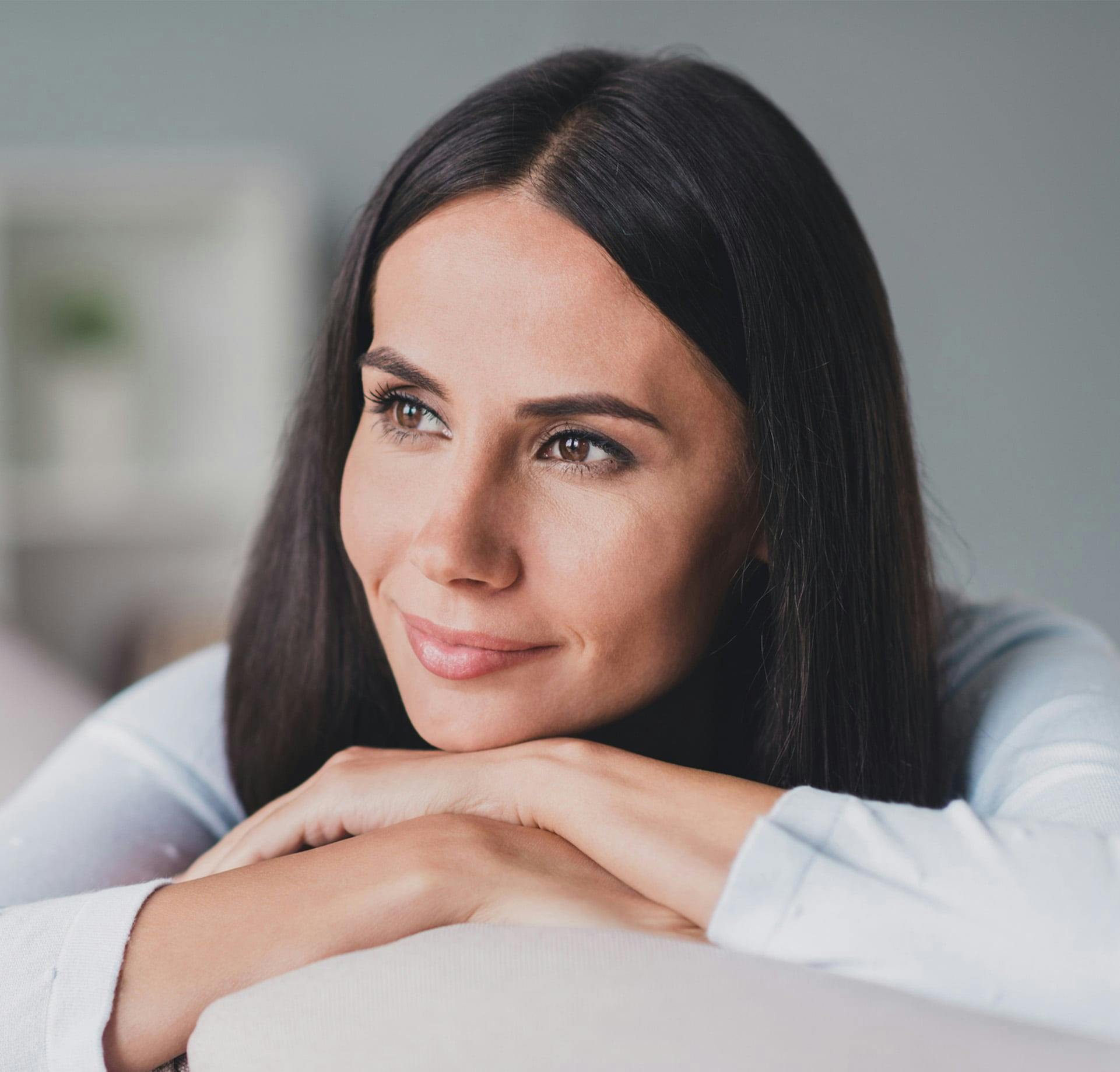 Woman on couch smiling