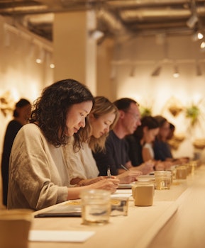 Consumers participating in a central location testing session, evaluating products in a controlled environment.
