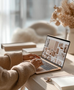 Person using a laptop during UX research session, illustrating MindMarket’s global user experience research services.