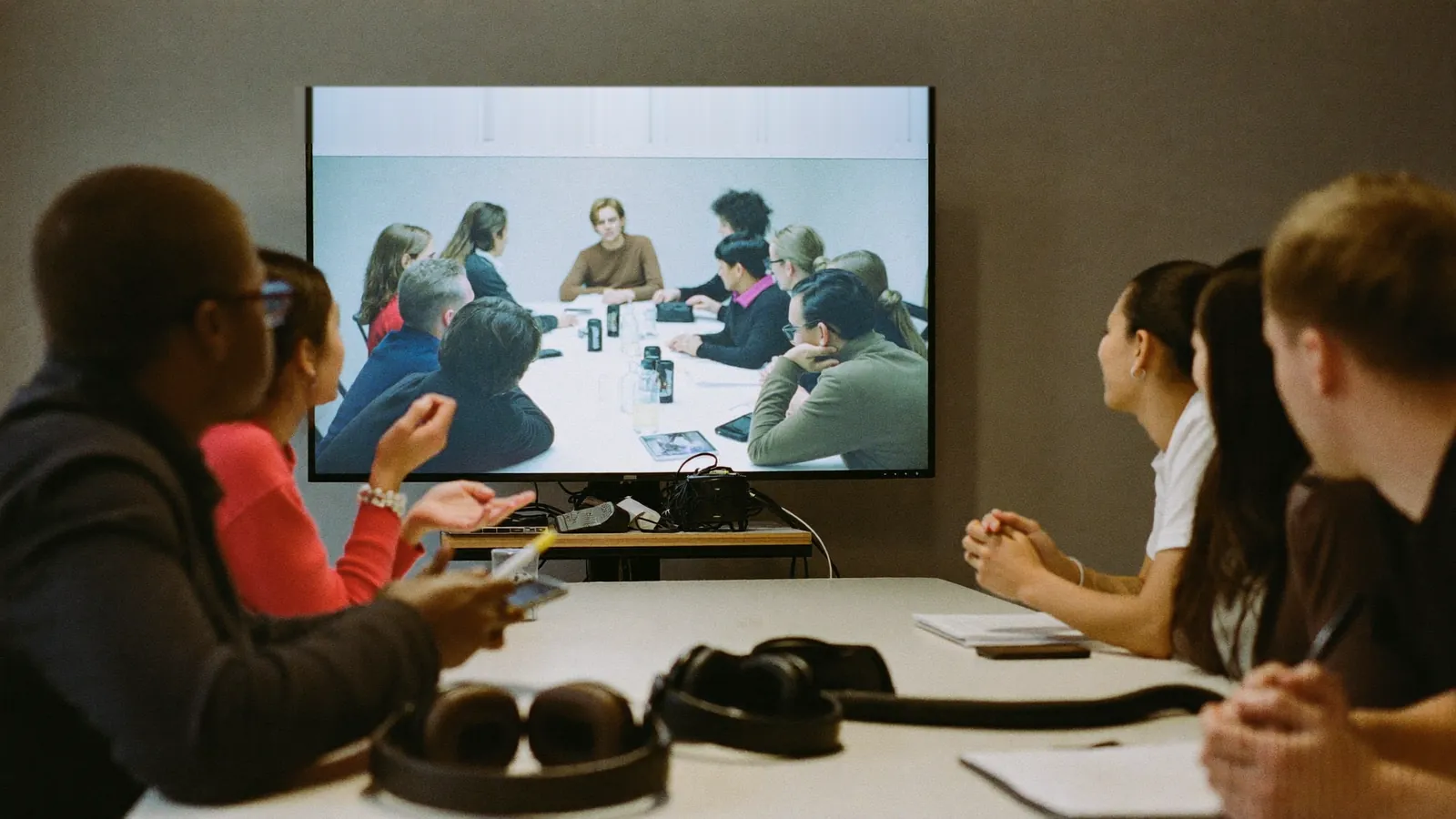 Client team watching an international focus group live with simultaneous translation