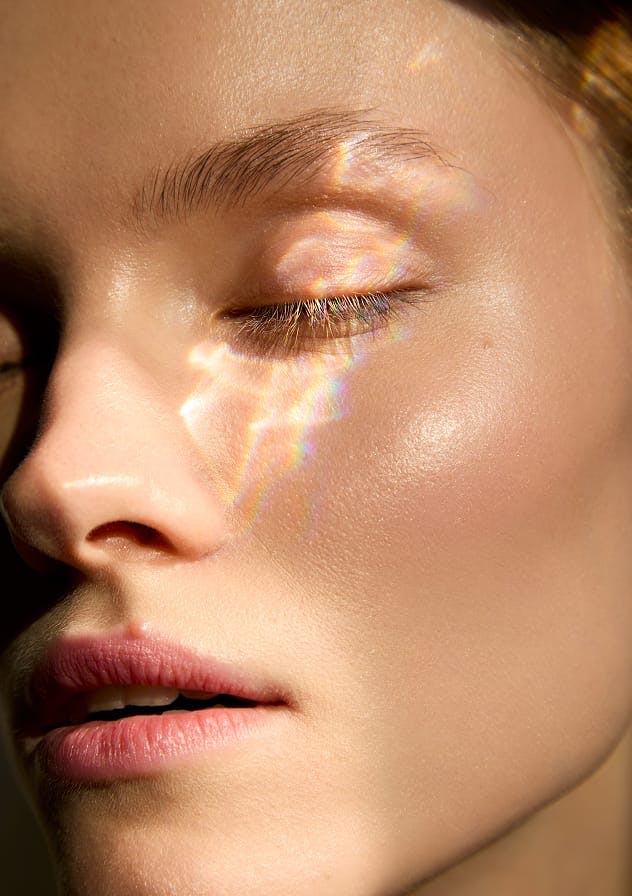 Close-up face with dappled light used as category card for Skin treatments