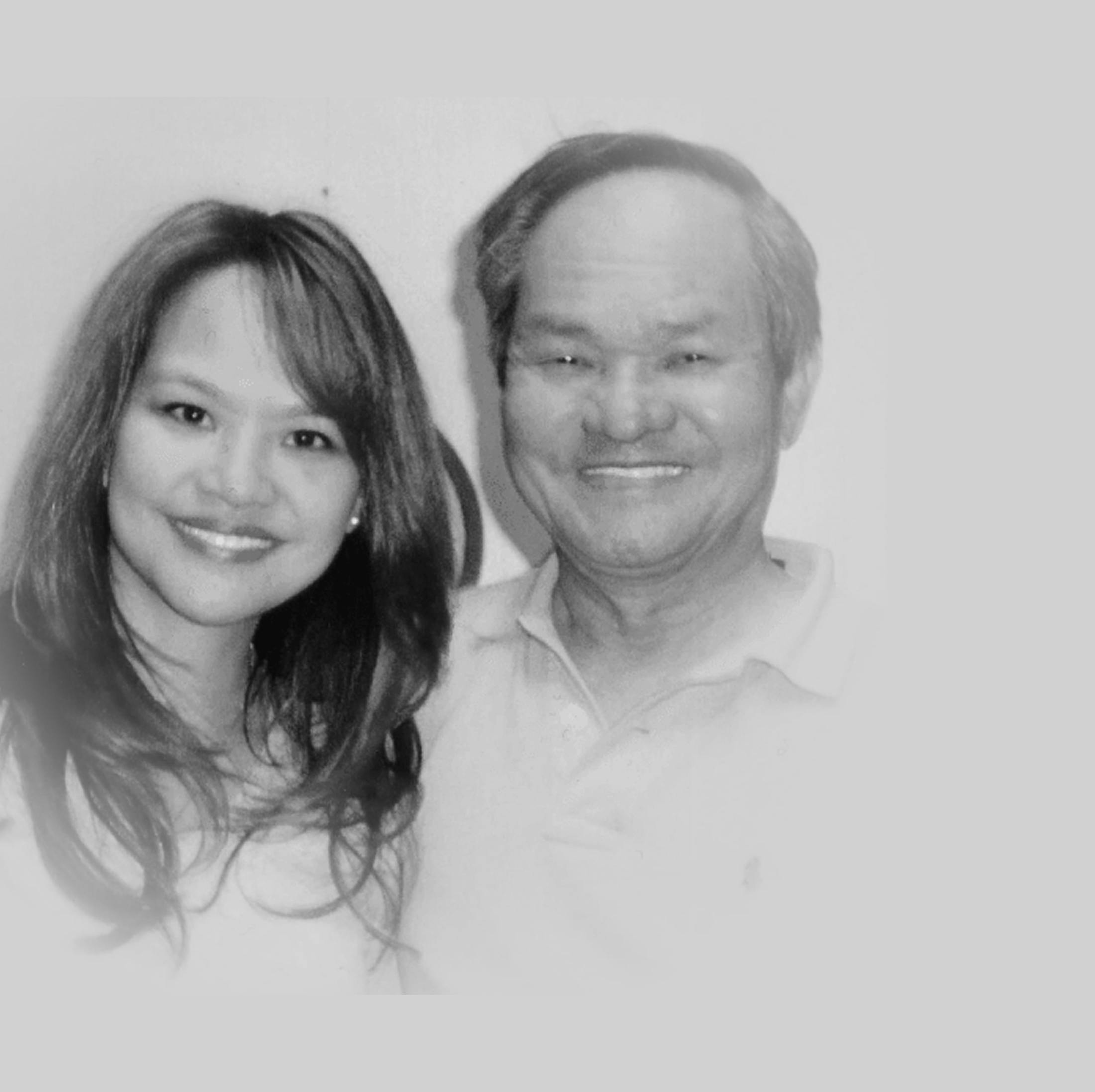Dr. Noll smiling with her father in a black and white photo