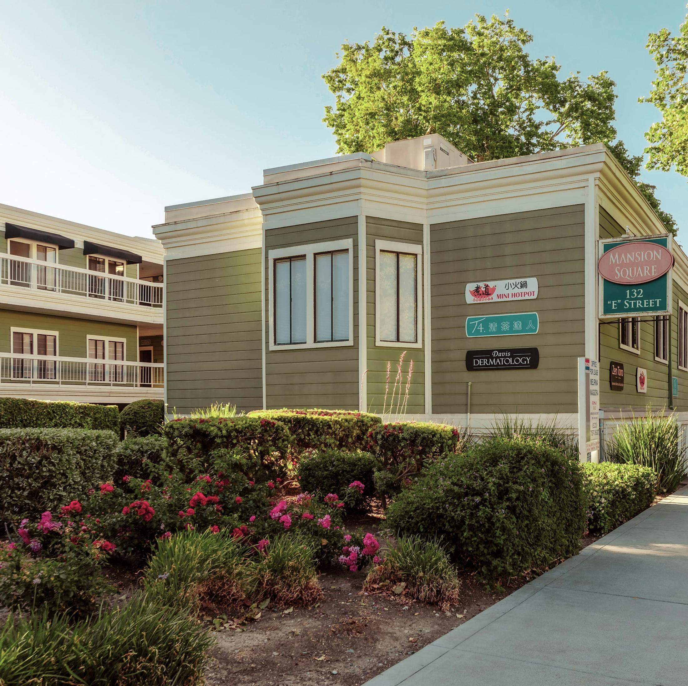 Exterior of Dr. Noll’s dermatology clinic with landscaped grounds
