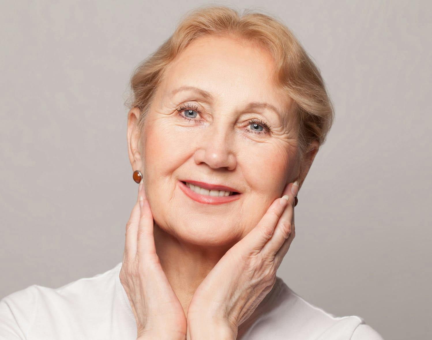 woman touching her face