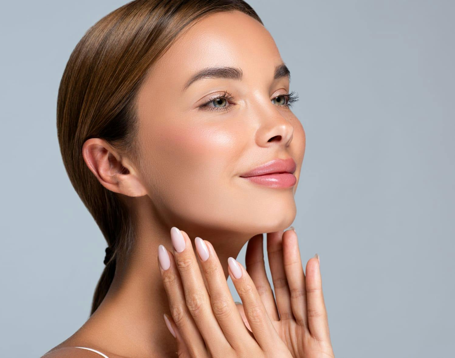 woman touching her face