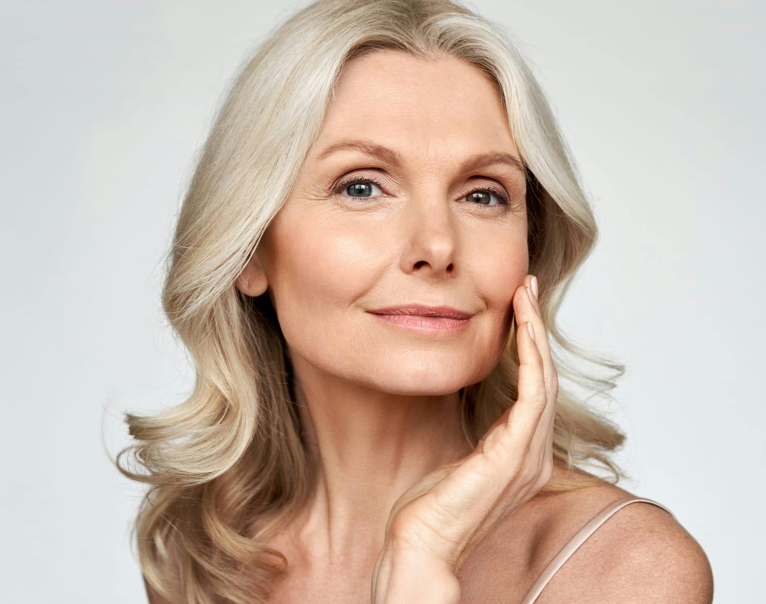 woman touching her face