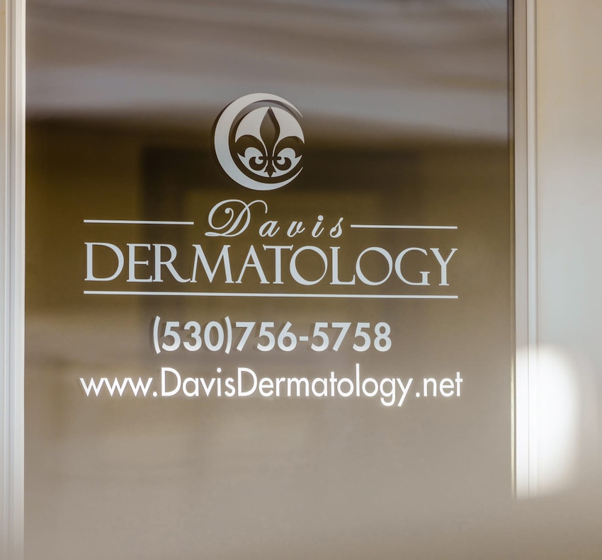 Davis Dermatology logo on a door