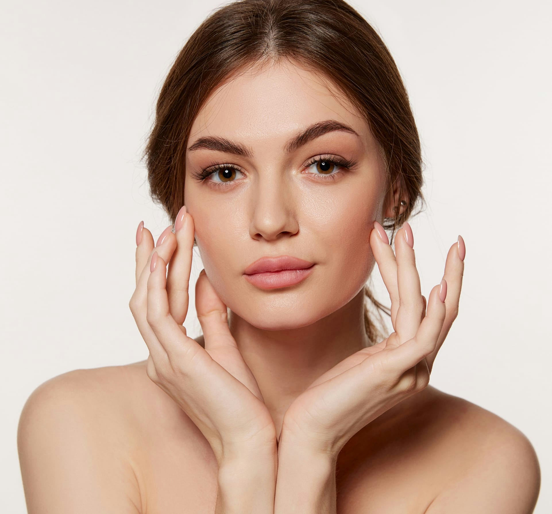 woman touching her face