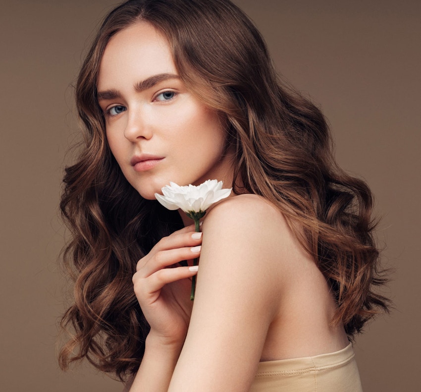 woman holding a flower