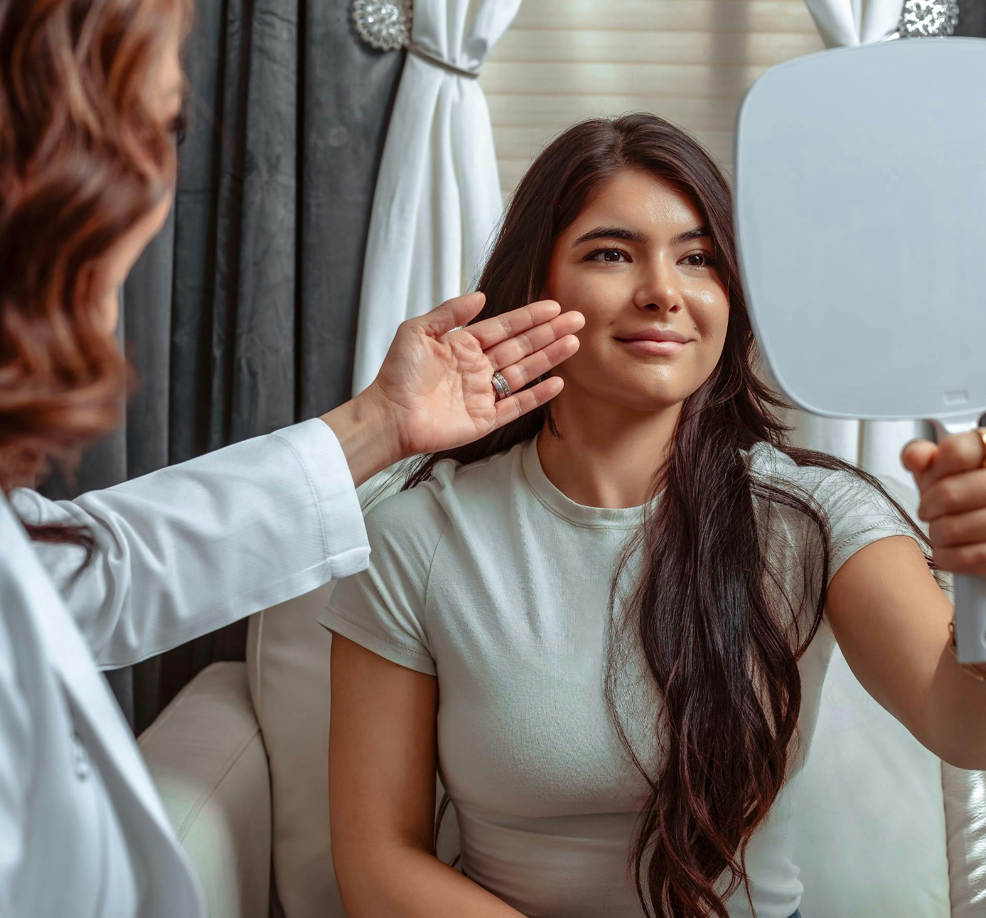 woman looking into a mirror