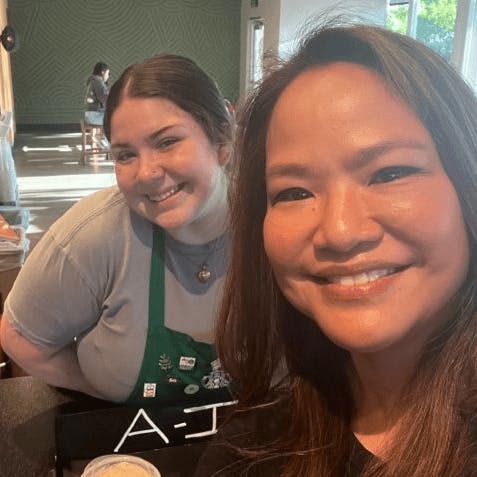 Dr. Noll smiling with a starbucks barista