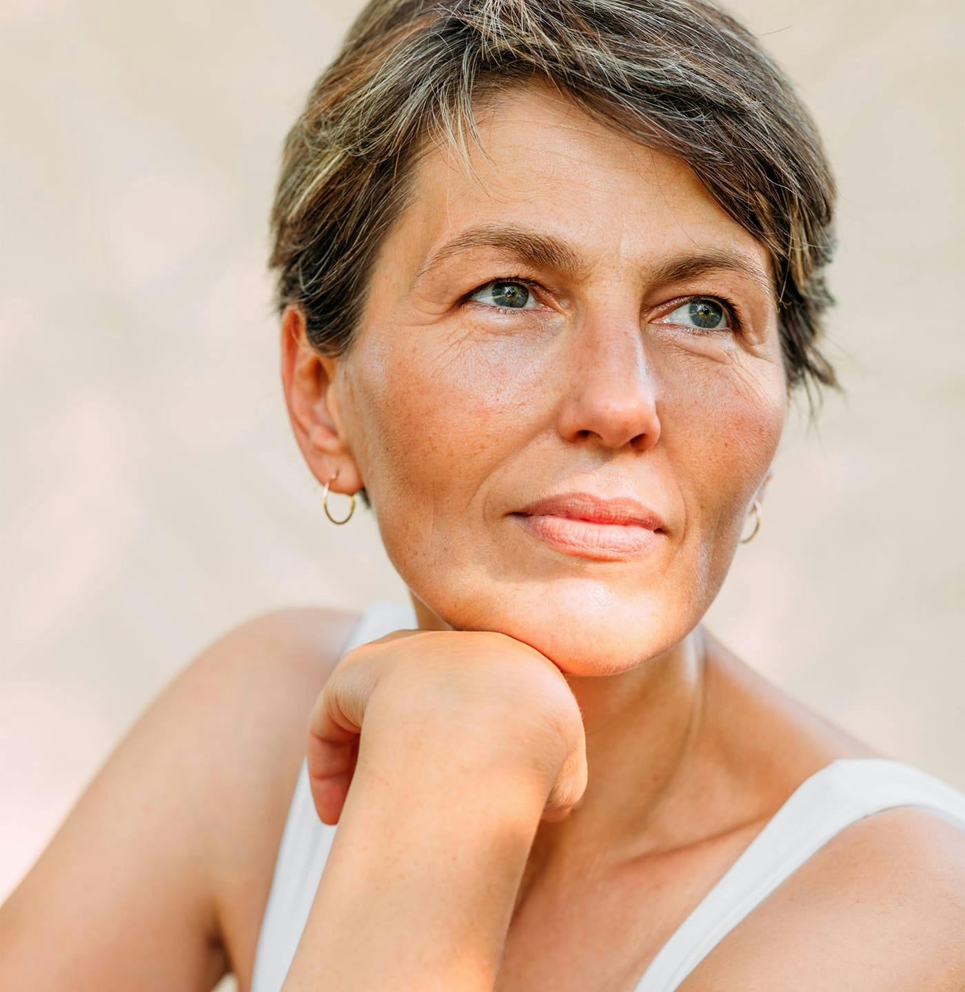 woman resting her chin on her hand