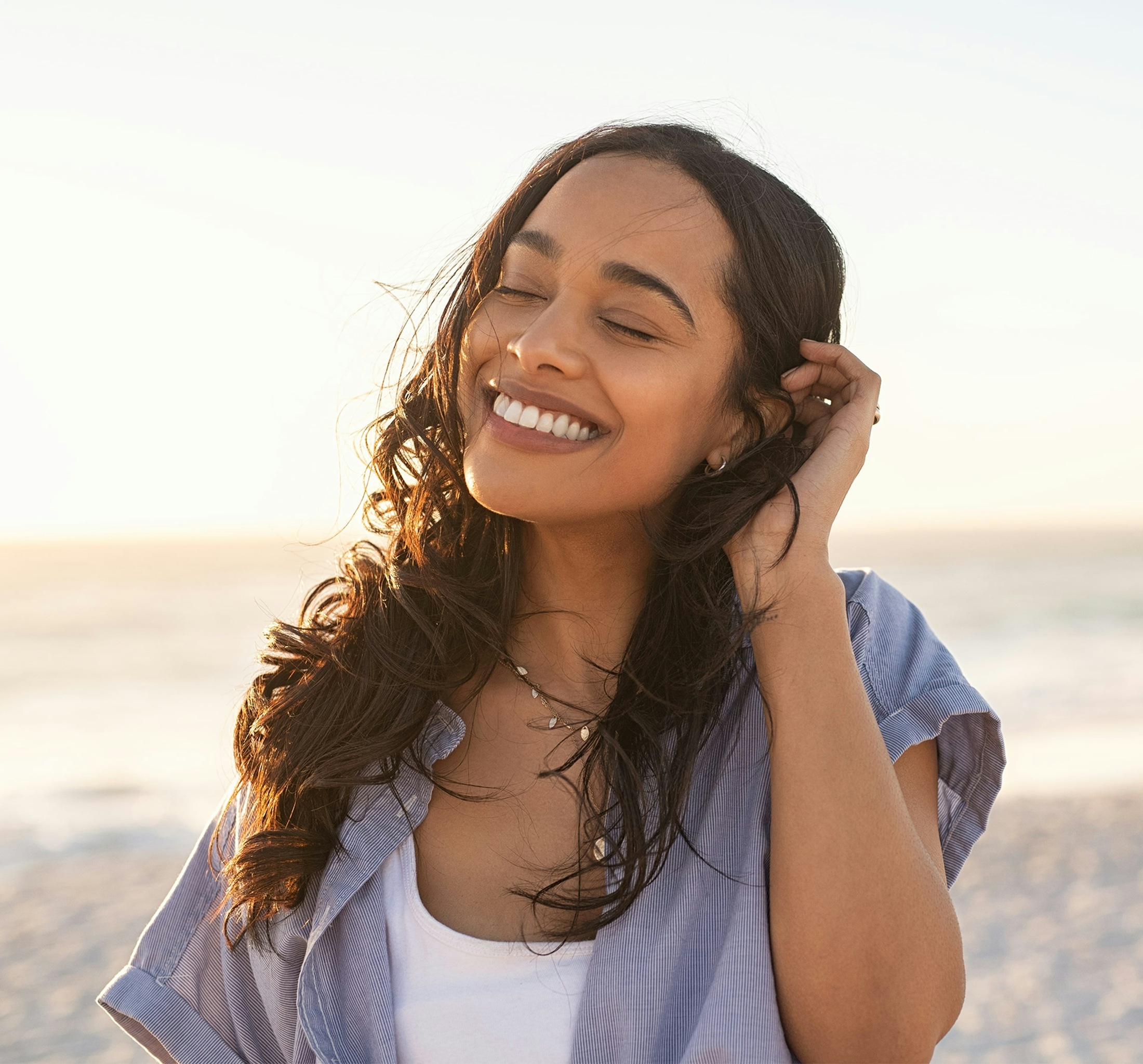 woman smiling at a clipboard