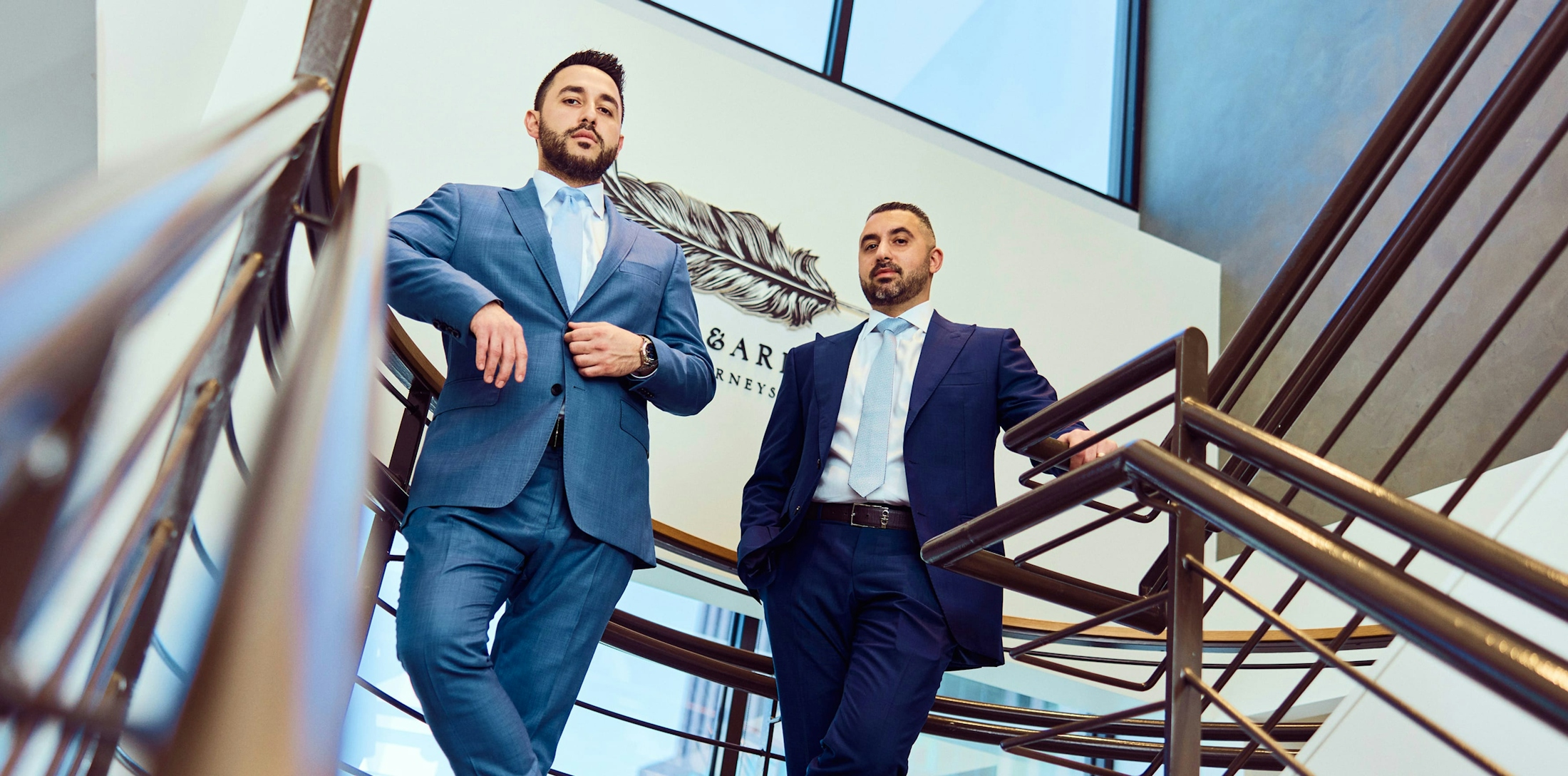Kevin and Jonathan standing on stairs