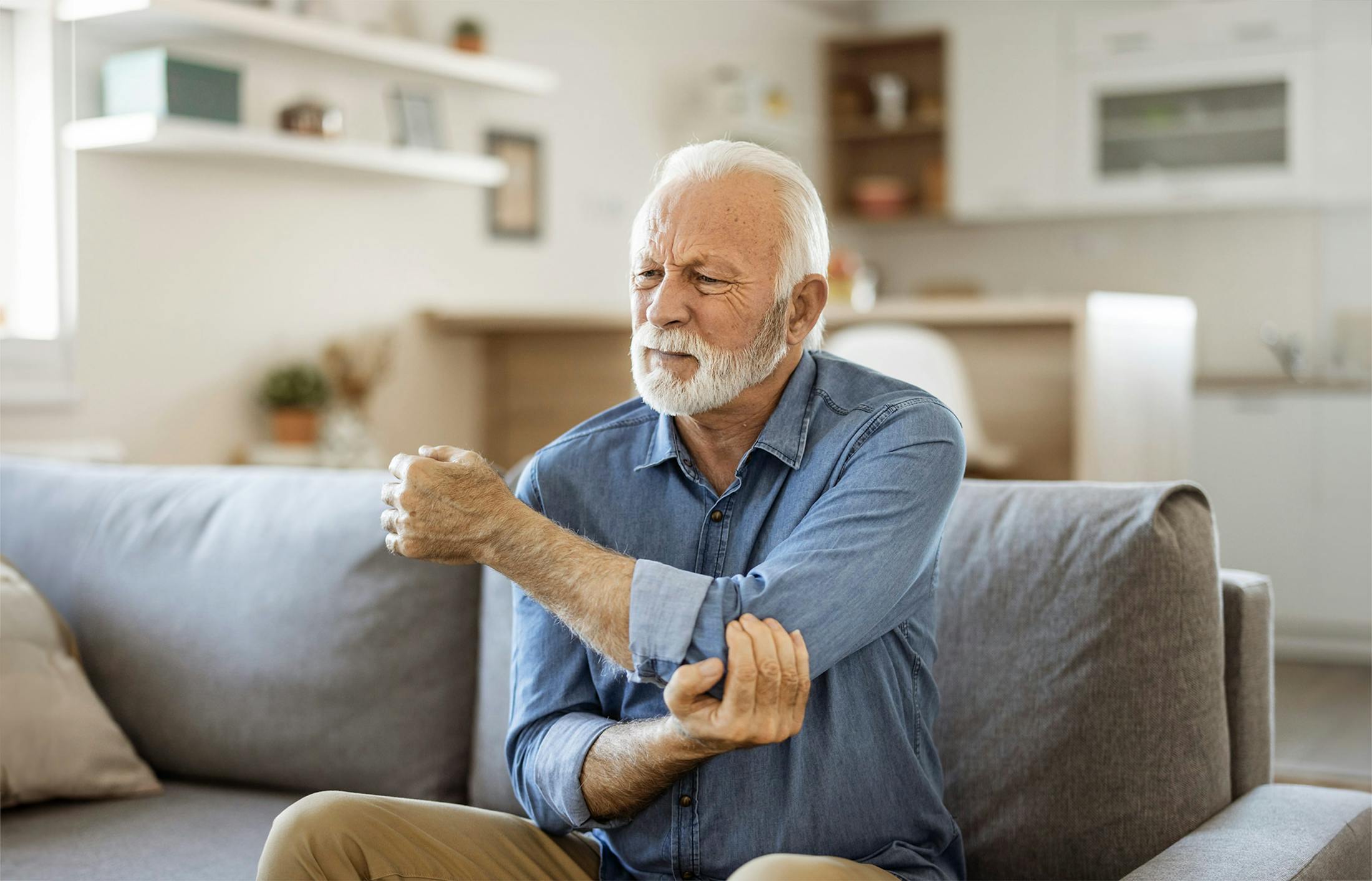 An old man who has a hurt arm