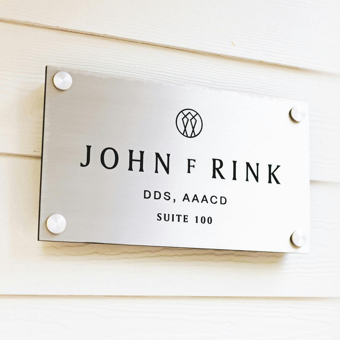 John Rick suite number on sign