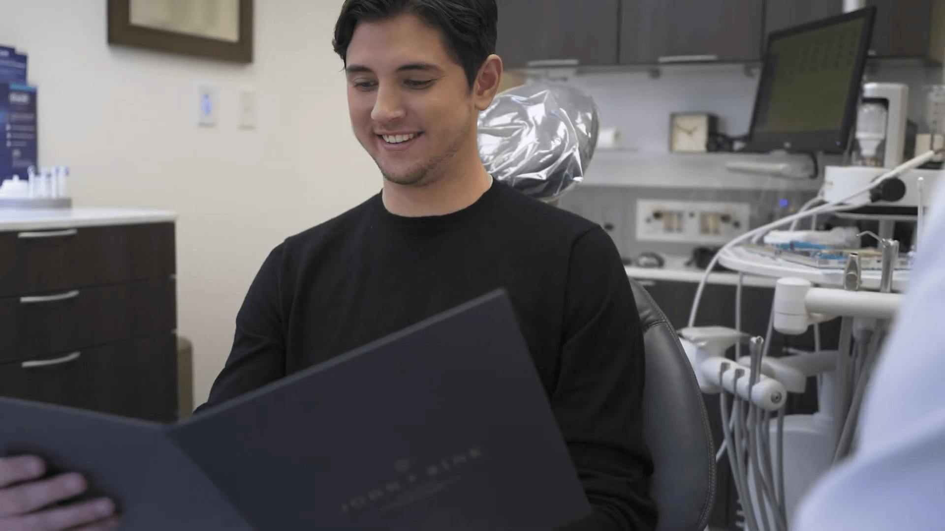 male client looking into folder