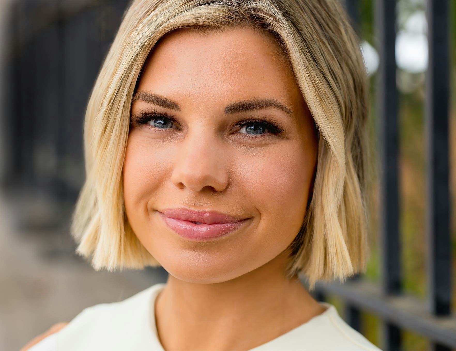 woman looking forward and grinning