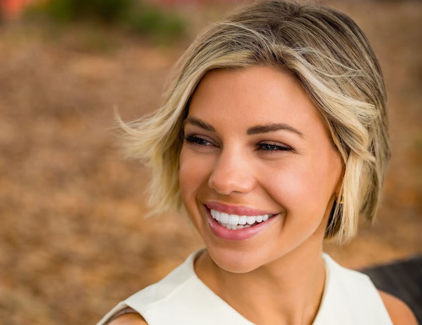 woman smiling outside