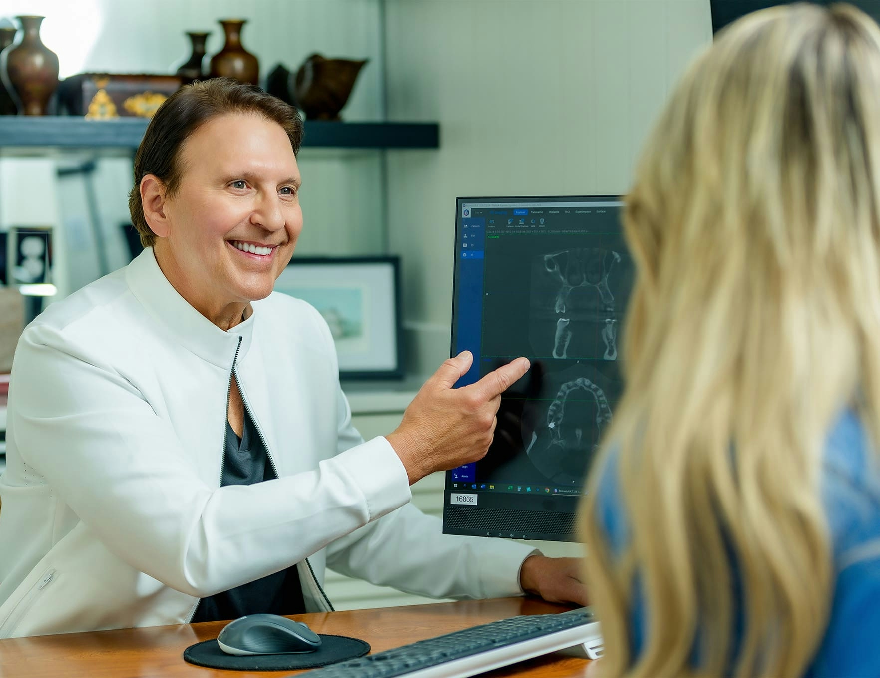 John Rink showing x-rays to patient