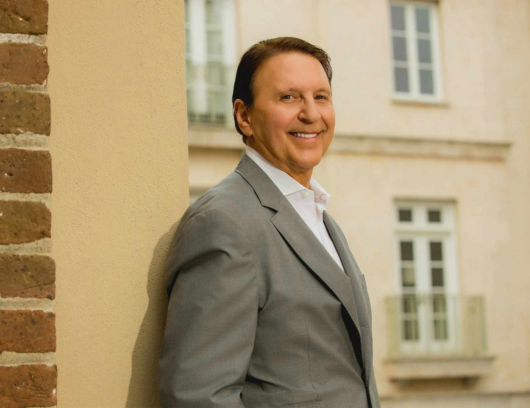 Dr. John Rink in gray suit