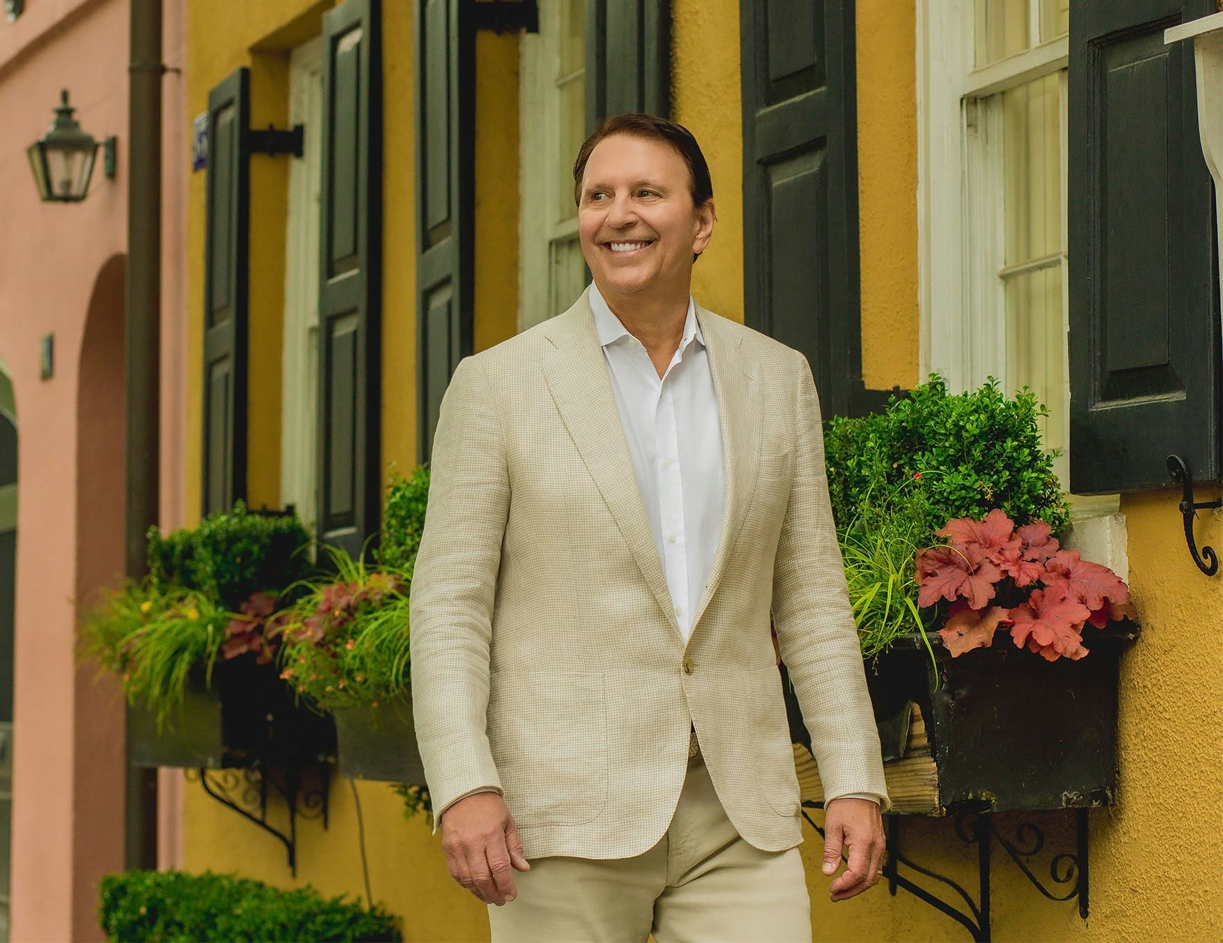 Dr. John Rink in suit walking