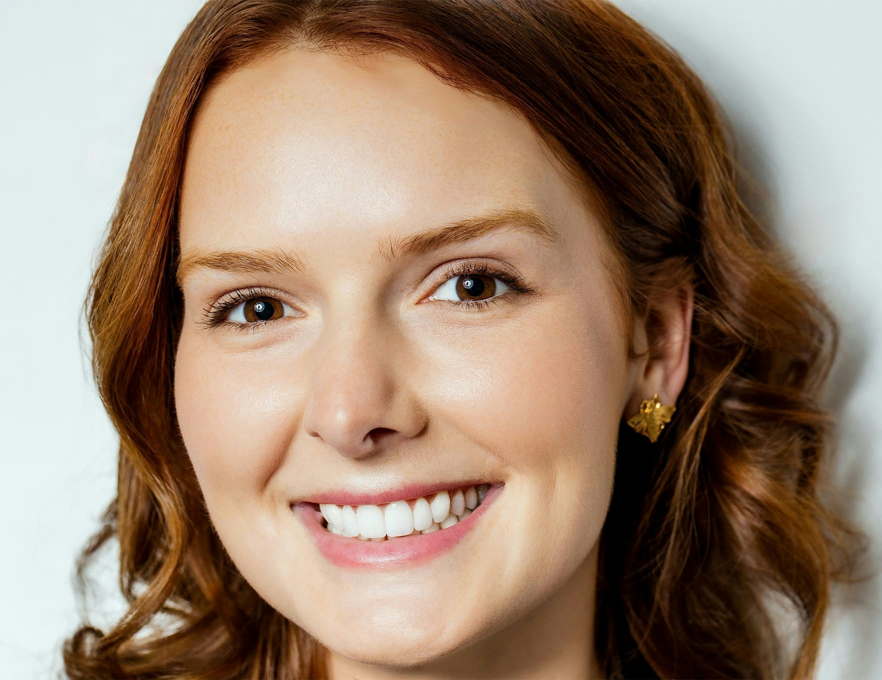 woman smiling with curly hair