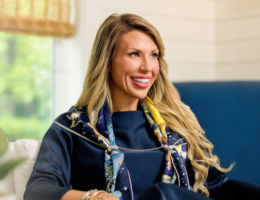 woman sitting down and smiling