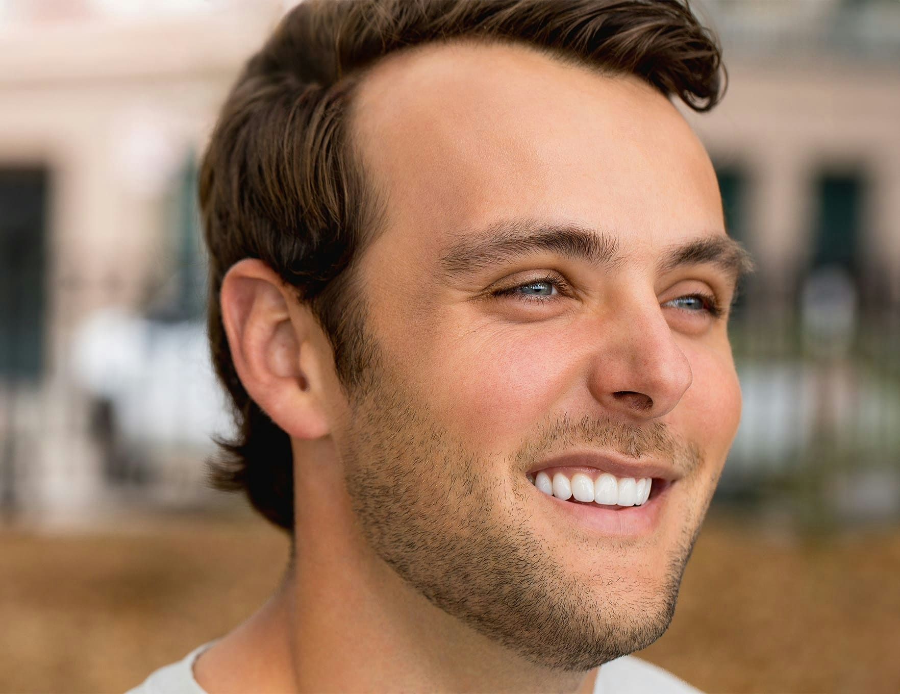 man smiling while being outside