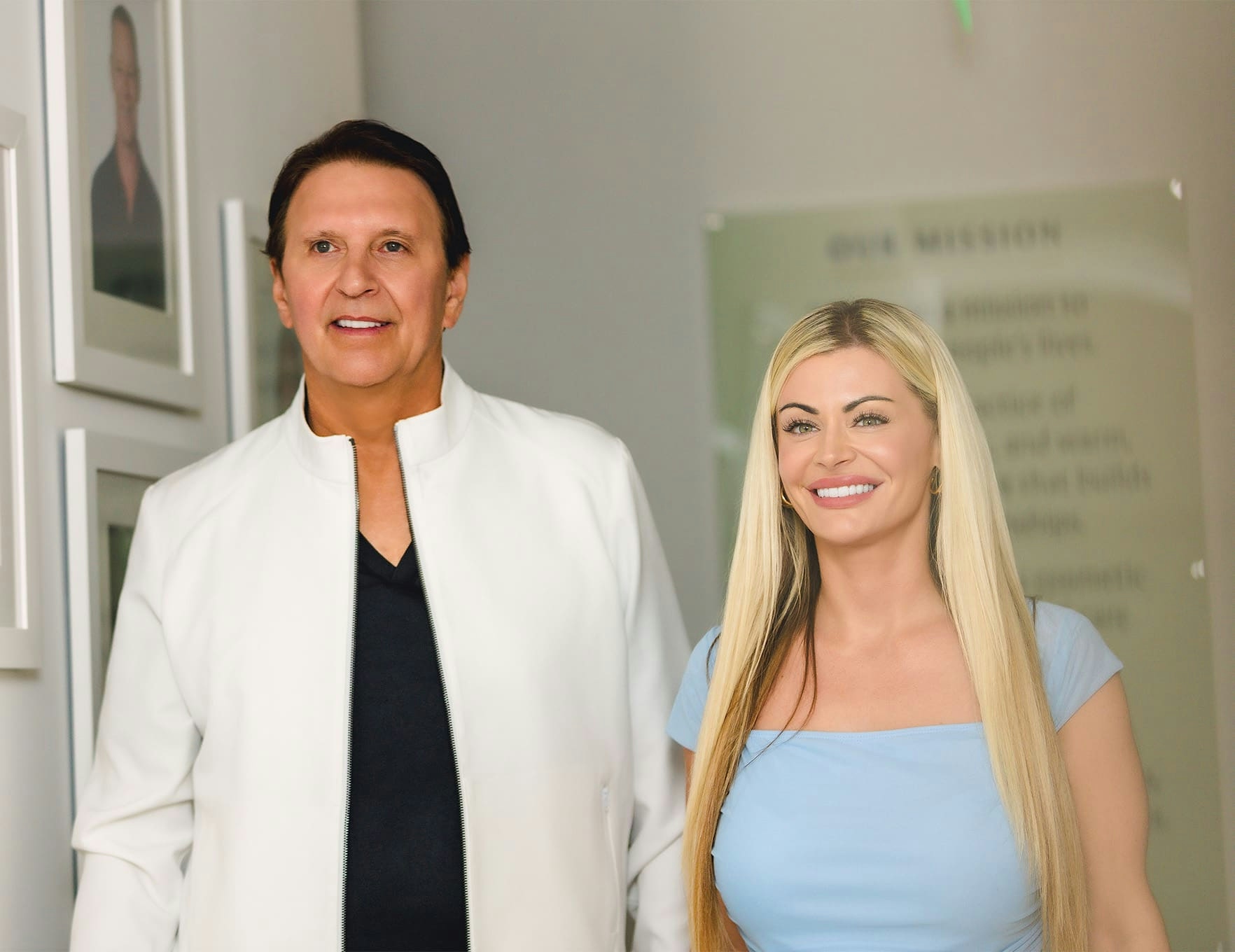 John and female patient smiling