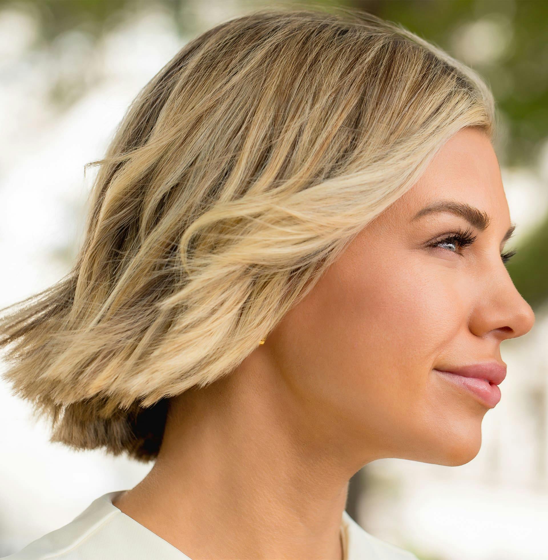 woman with short hair blowing in the wind