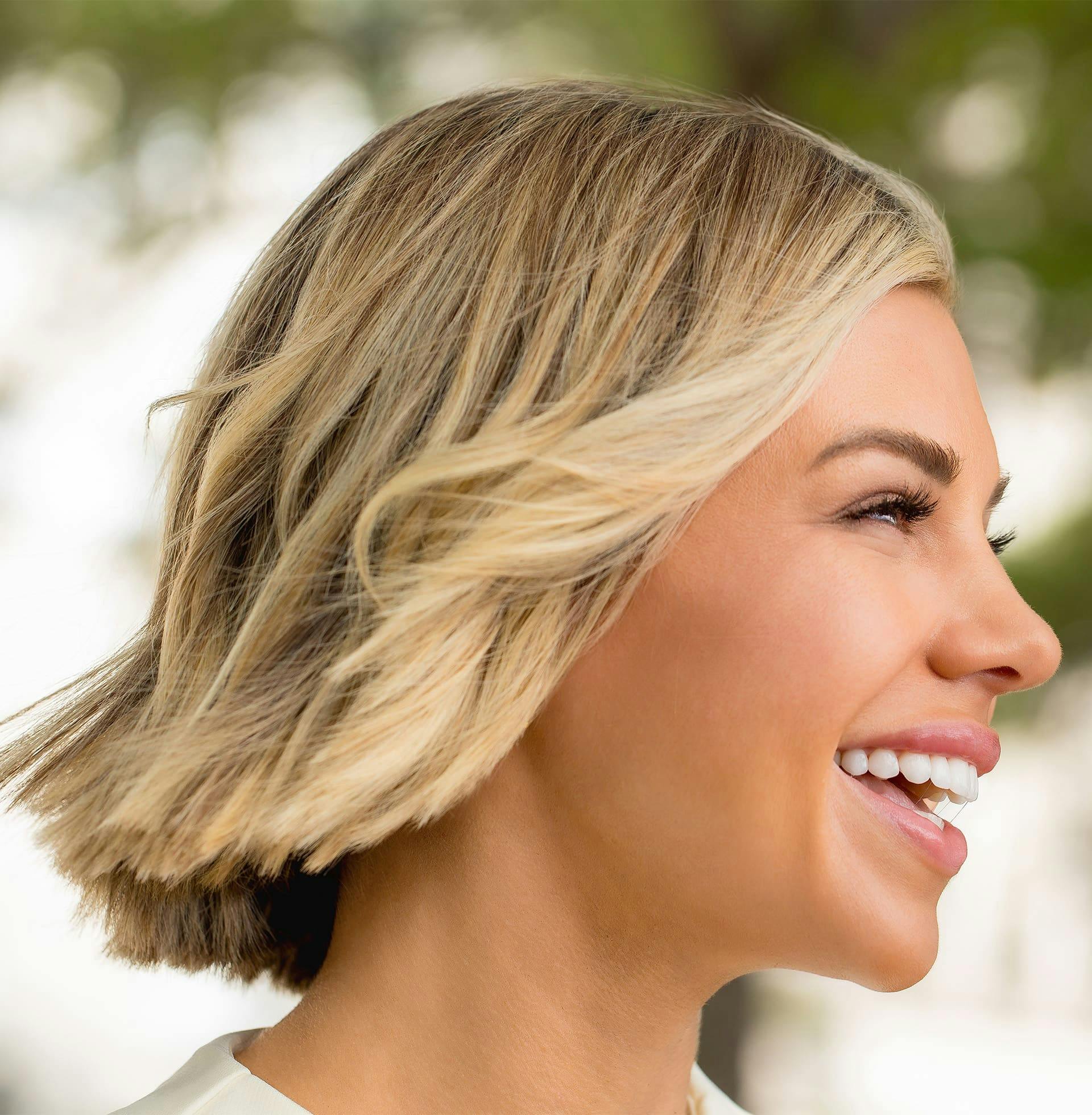 woman with short hair smiling