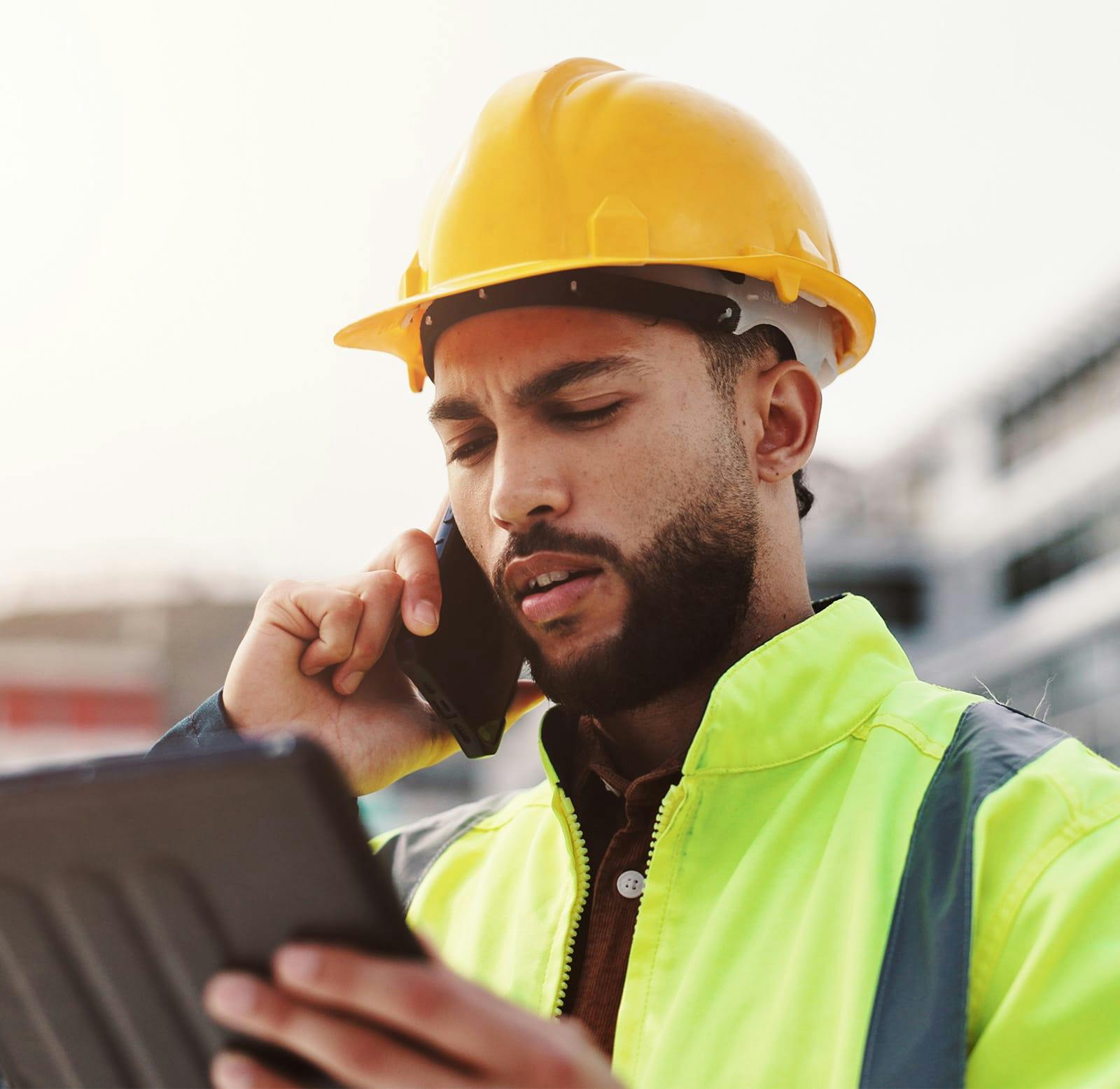 construction worker on the phone