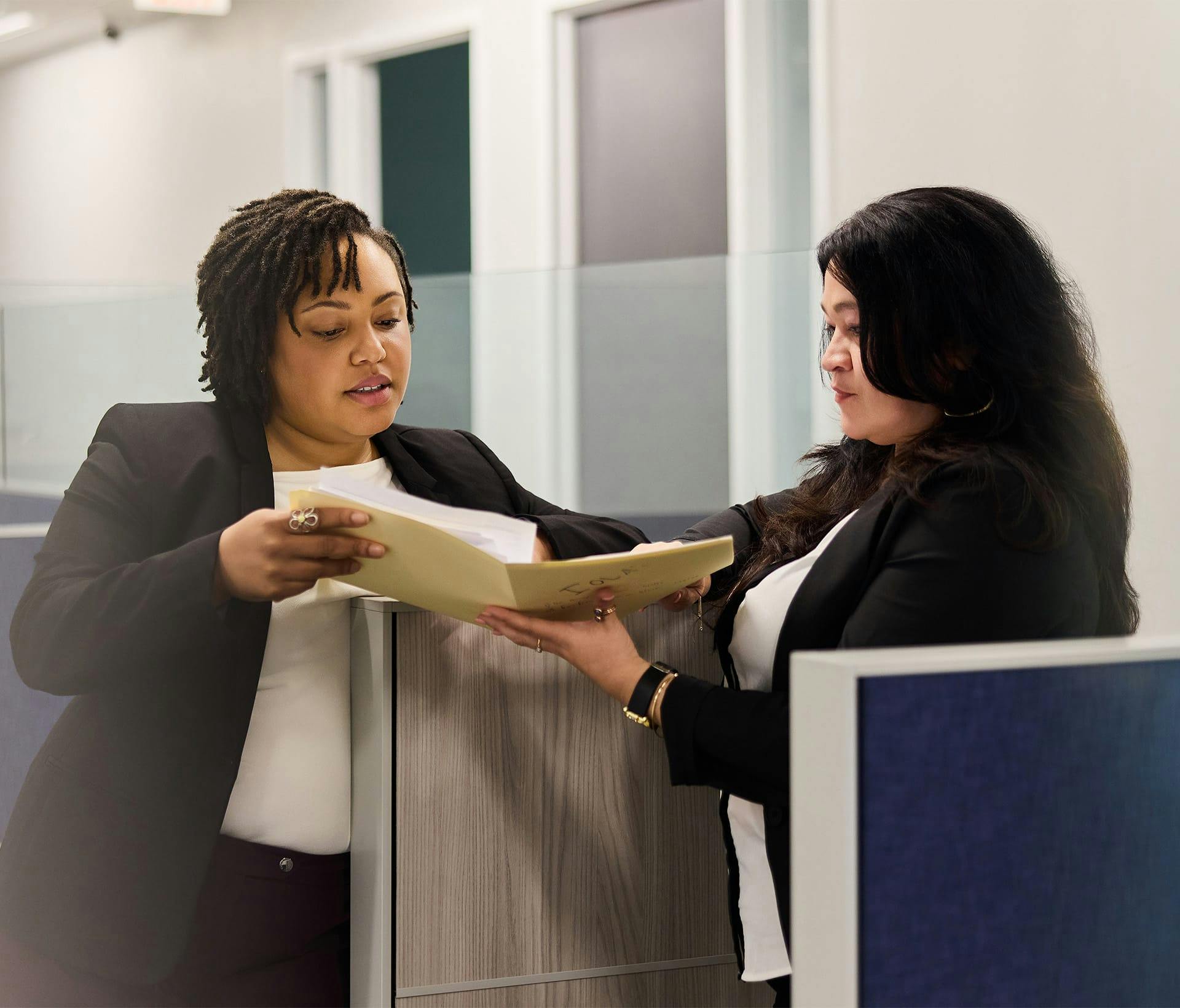 two attorneys looking at a file