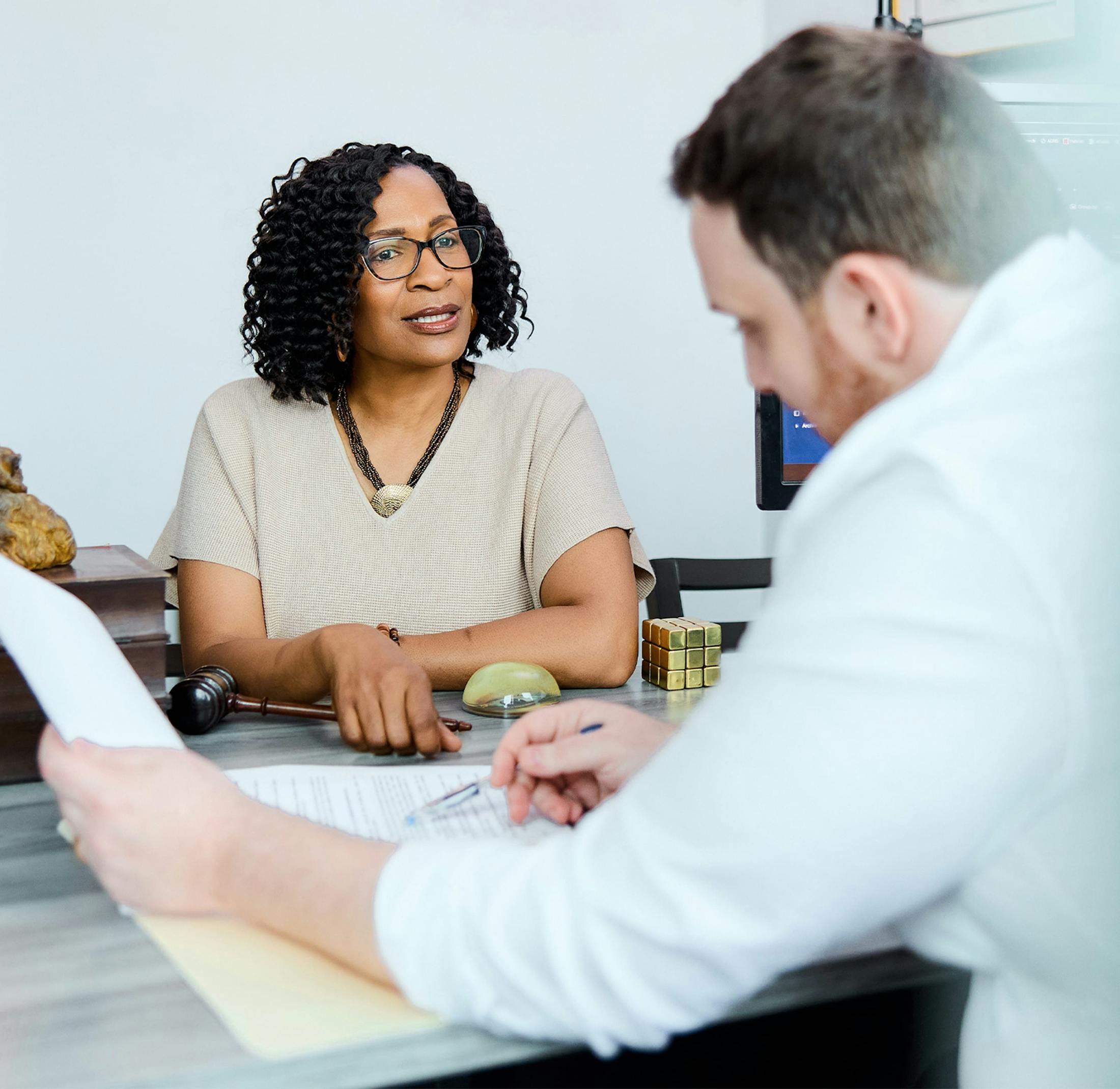 two people looking at paperwork