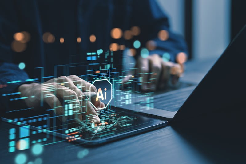 Man using laptop with AI concept