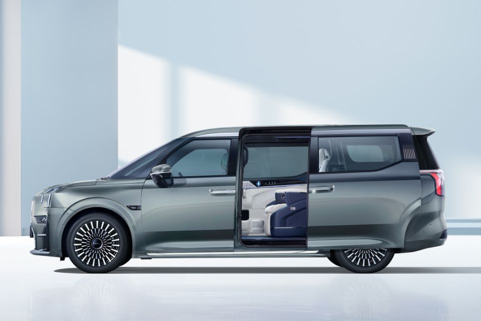 Exterior side view of the Zeekr 009 luxury electric MPV in Grey Purple with the side door open showing the Midnight Blue and Polar White interior