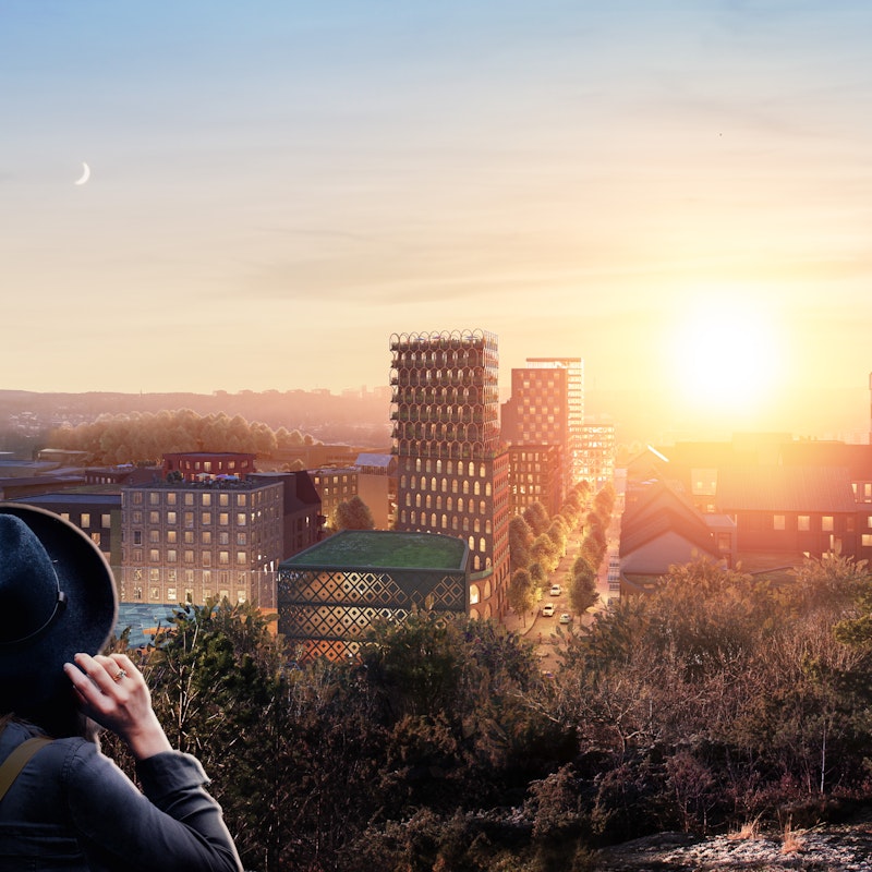 Södra Änggården Visionsbild i skymning. Vy från Änggårdsbergen ned mot bostadsområdena.