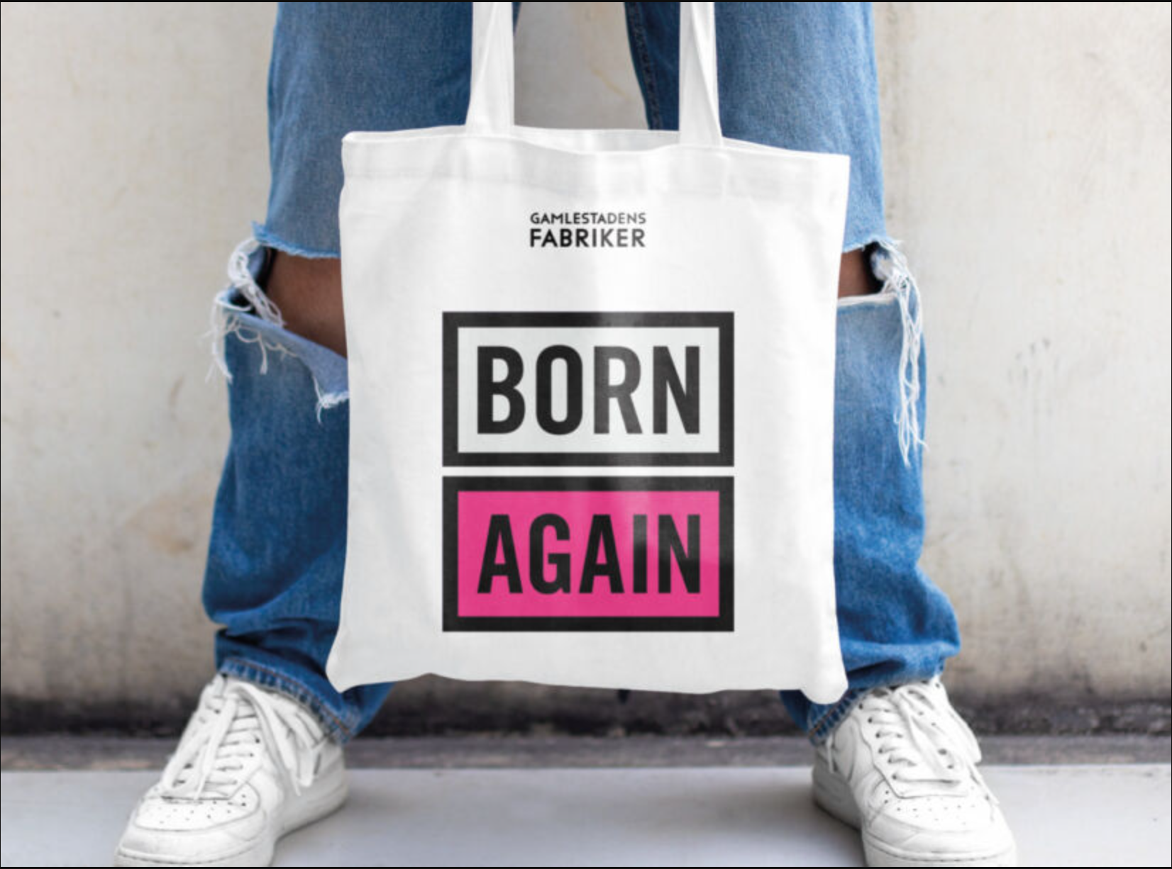 En bild på en kasse med texten Born Again från Gamlestadens Fabriker
